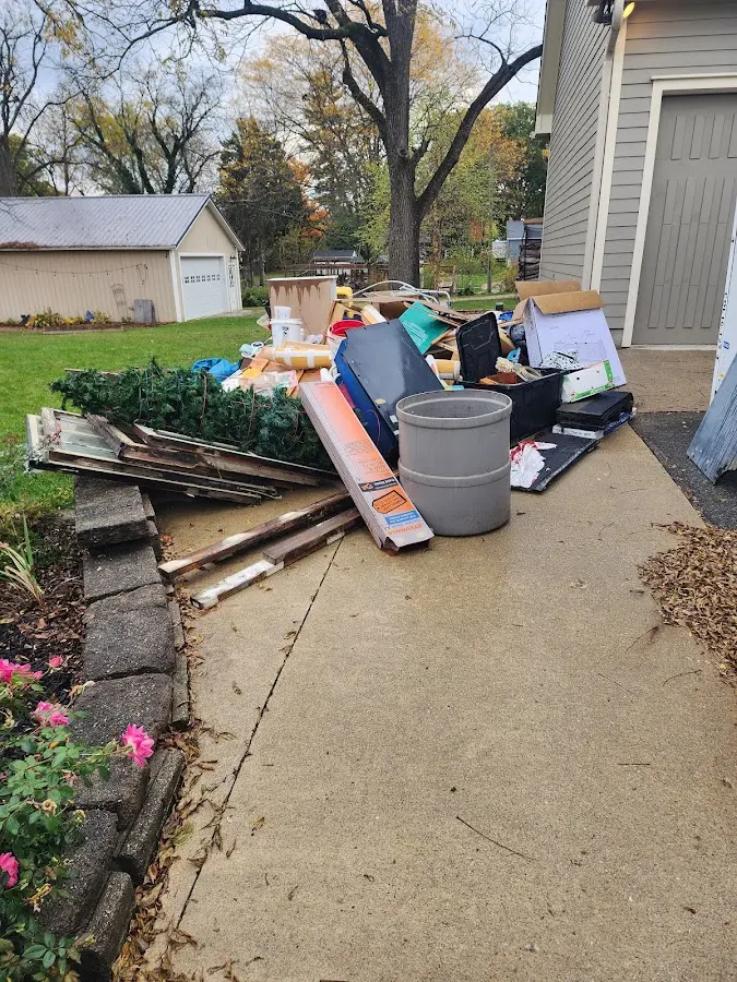 Dumpster being loaded with debris for Roofing Dumpster Rental in Molalla
